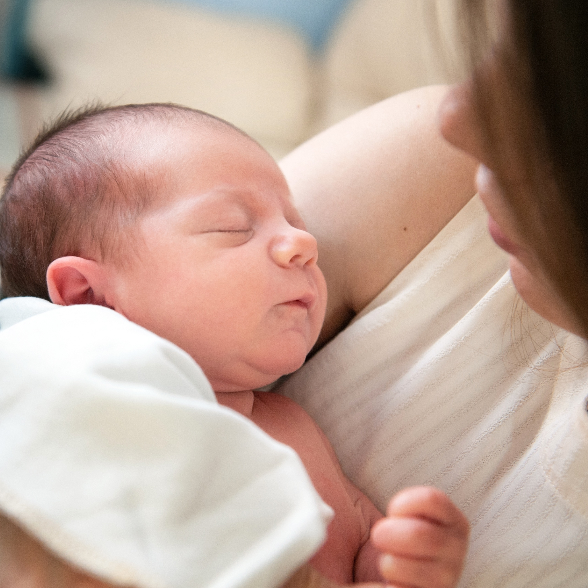 Priya holding her newborn